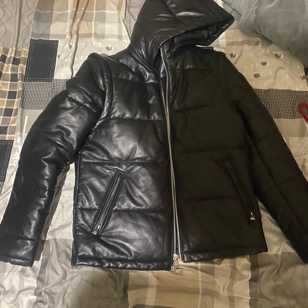 Neiman Marcus leather jacket sleeves and hoodie unzip.